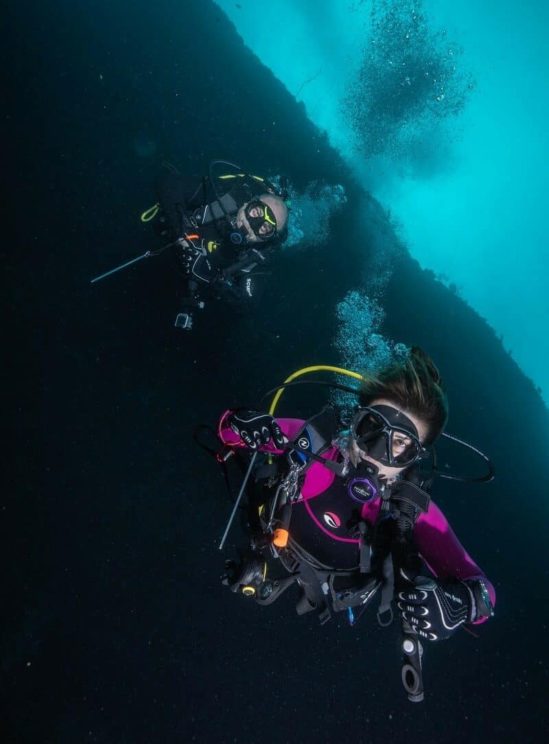 divers pose at the deep