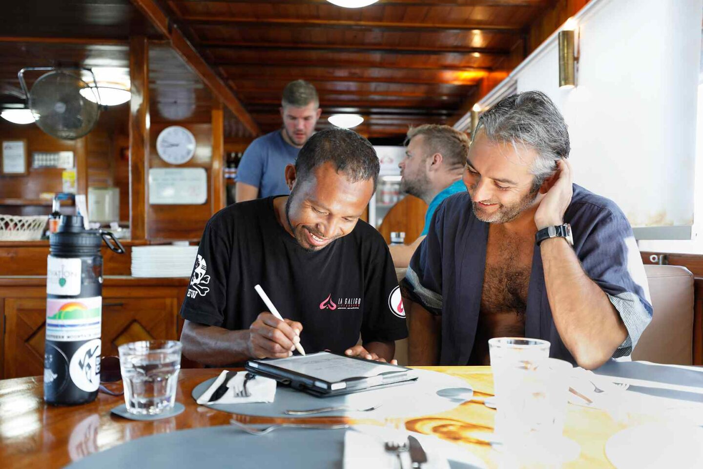 Top Activities To Do in Komodo Island: Dragons, Diving & Day Trips 9 Our crew is mingling with our guest