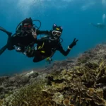 scuba diver couples posing in Mawan dive site Komodo National Park 1