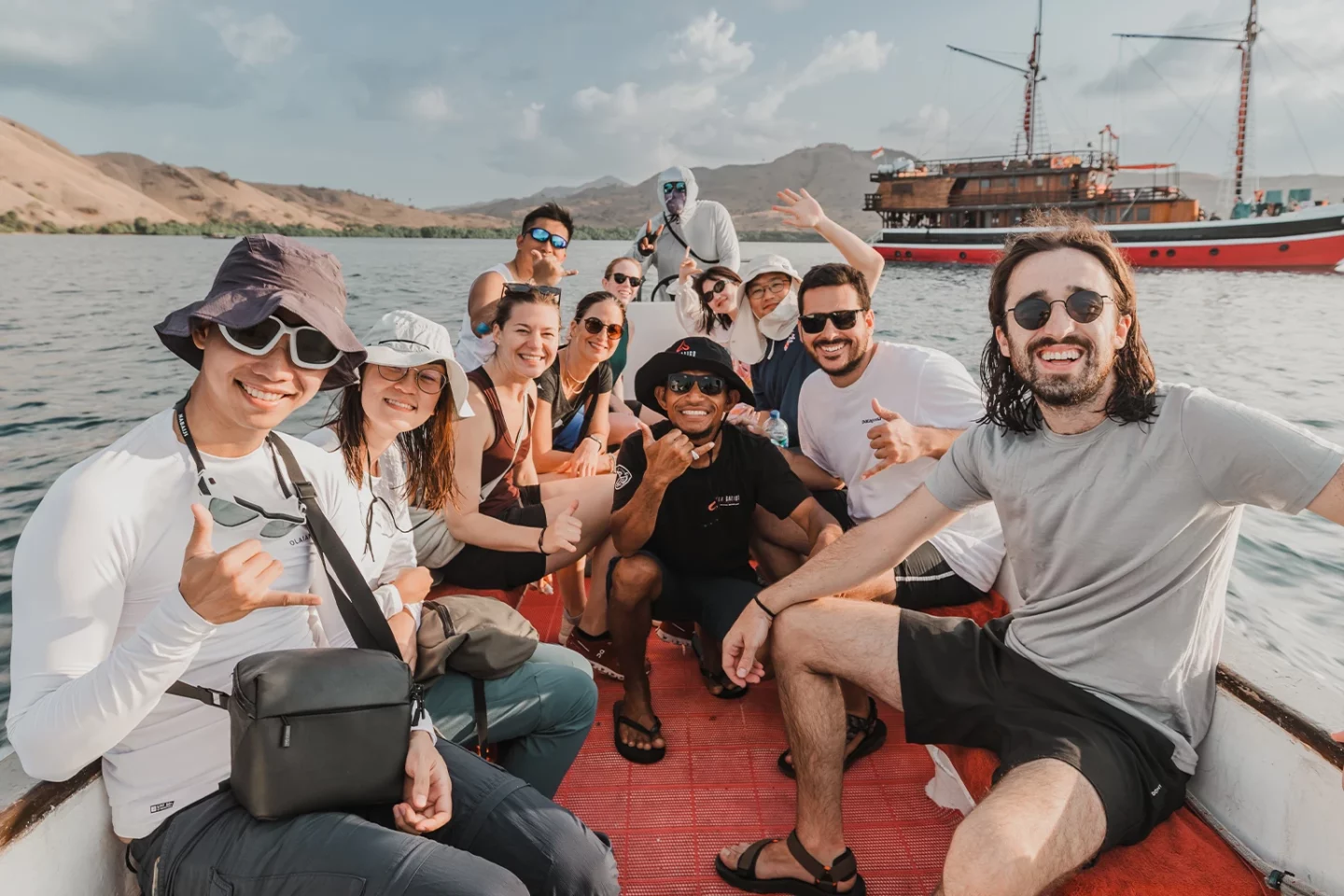 guests posing in a fun vibe on a speedboat in komodo national park