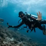 scuba diver posing to camera in Mawan dive site Komodo National Park scaled 1