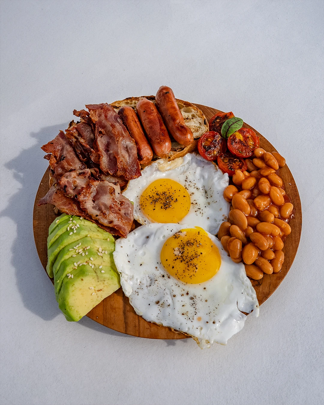 Classic boat breakfast plate with toast, eggs, and tropical fruits.