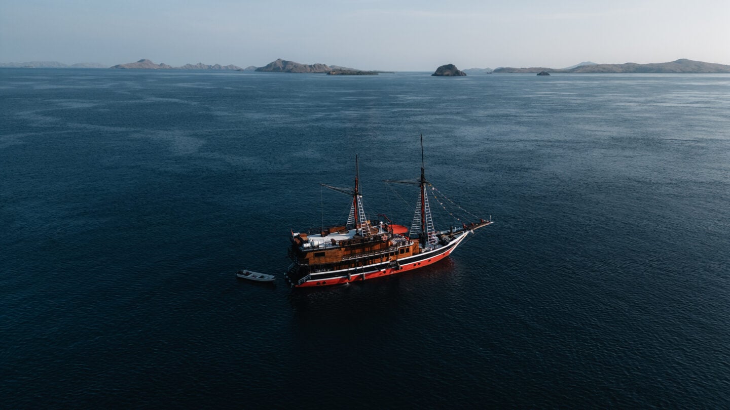 La Galigo liveaboard vessel sailing across calm tropical seas, representing the start of a well-planned diving journey from booking to onboard experience